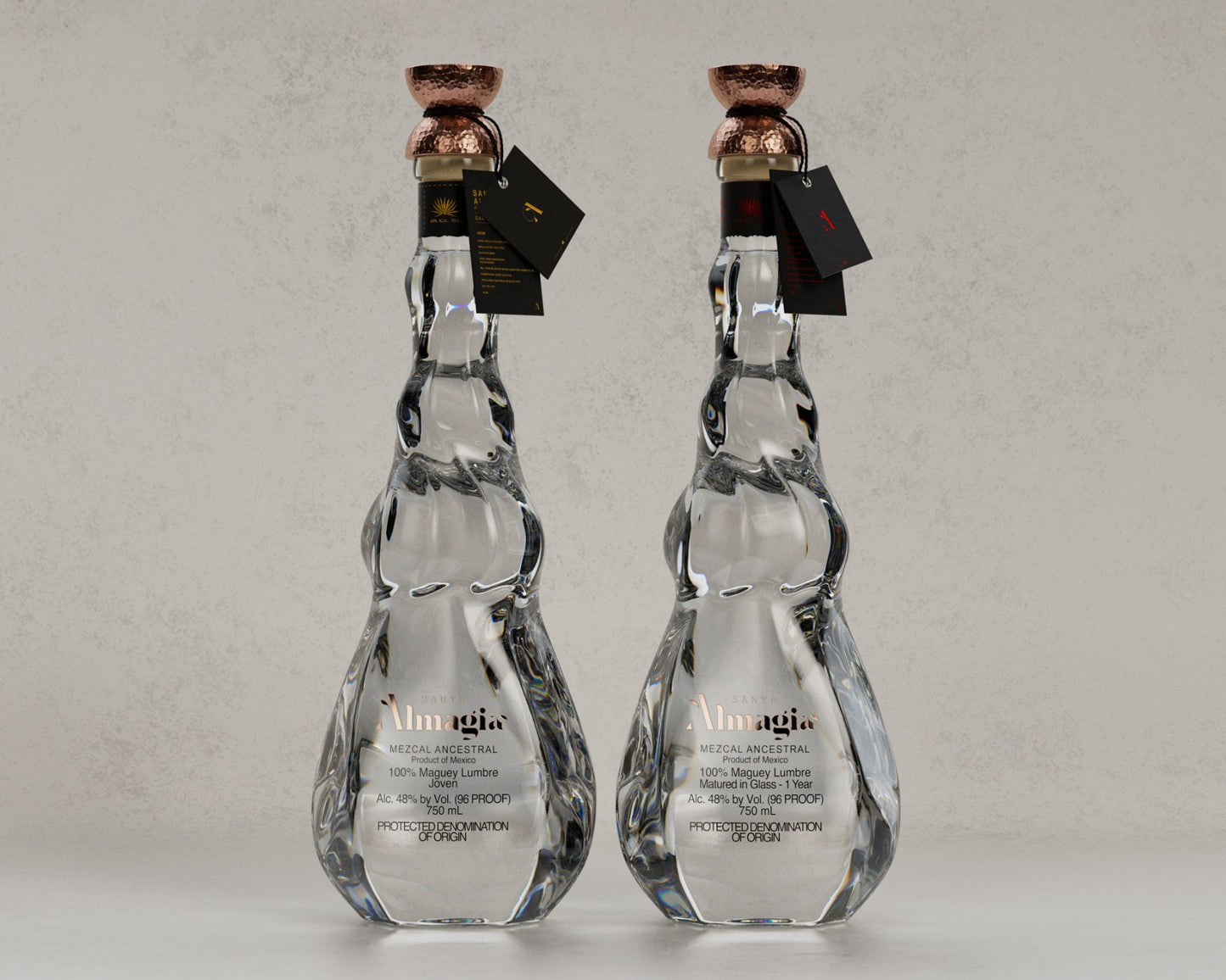 Two clear glass bottles with marble pattern and bronze caps on a light gray background