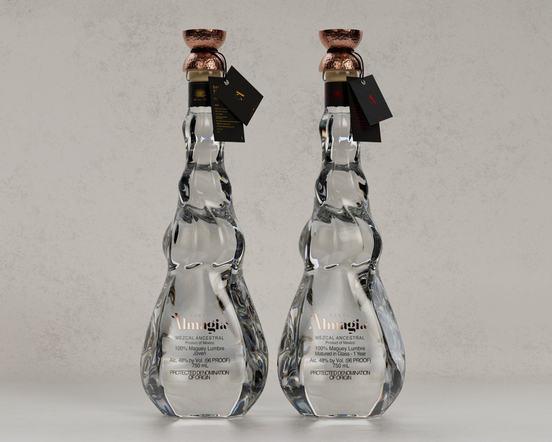 Two clear glass bottles with marble pattern and bronze caps on a light gray background
